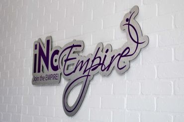 Logo iNc EMPIRE, LLC Brick Wall Metal Machined