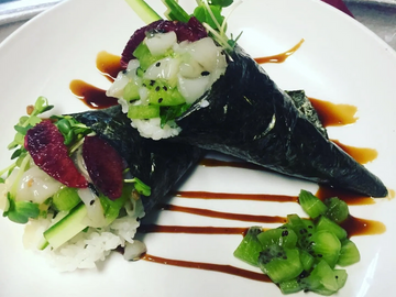 SOY MARINATED FRESH SCALLOP, SUSHI RICE, KIWI, BLOOD ORANGE & MICRO CILANTRO WRAPPED IN  SEAWEED PAP