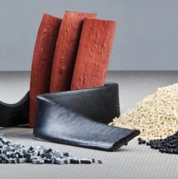 Black and brown machine parts with granules.