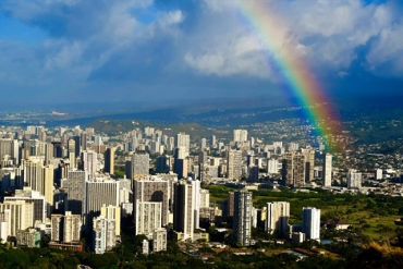 Rainbow over a city skyline.