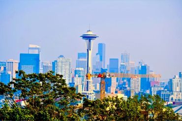 Seattle skyline with Space Needle and construction crane.