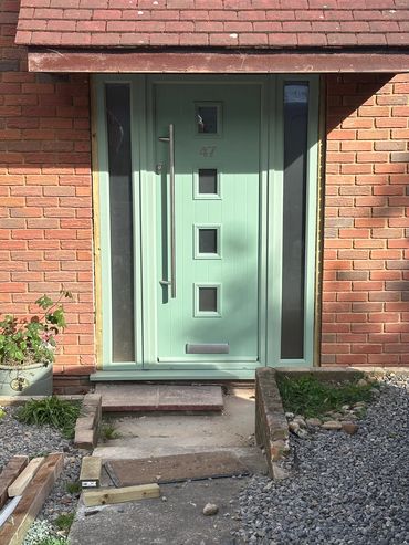 Replacement front door to composite sage green door with locking mechanism