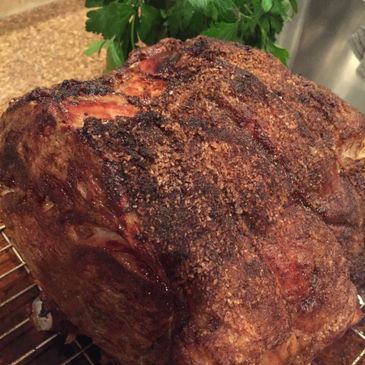Close-up of a seasoned and roasted meat with a crispy crust.
