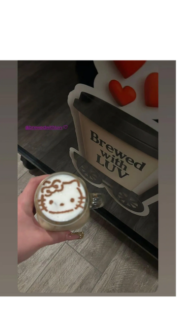 Latte art of Hello Kitty on a coffee cup at Brewed with LUV café.