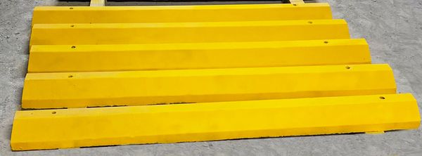 72" Yellow Painted Wheel Stops in Tampa, Florida