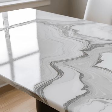 Polished marble table with elegant gray veins and glossy finish.