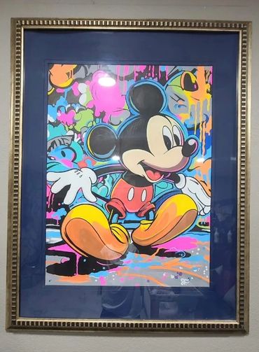 Colorful graffiti-style artwork of Mickey Mouse in a decorative frame.