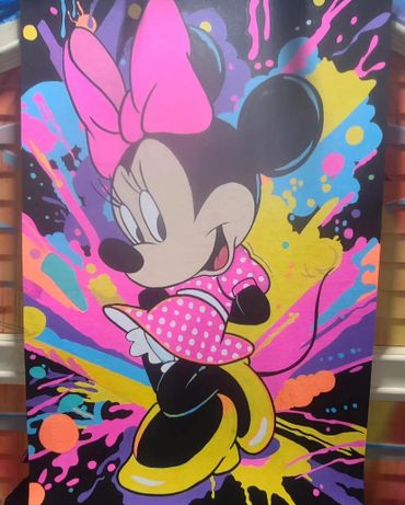 Colorful graffiti art of Minnie Mouse with vibrant splashes in the background.
