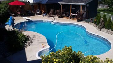 Inground swimming pool with Kreepy Krauly vacuum system