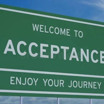Green road sign that says Acceptance enjoy your journey