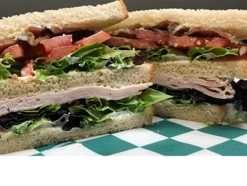 club sandwich with turkey, lettuce, tomato and bacon