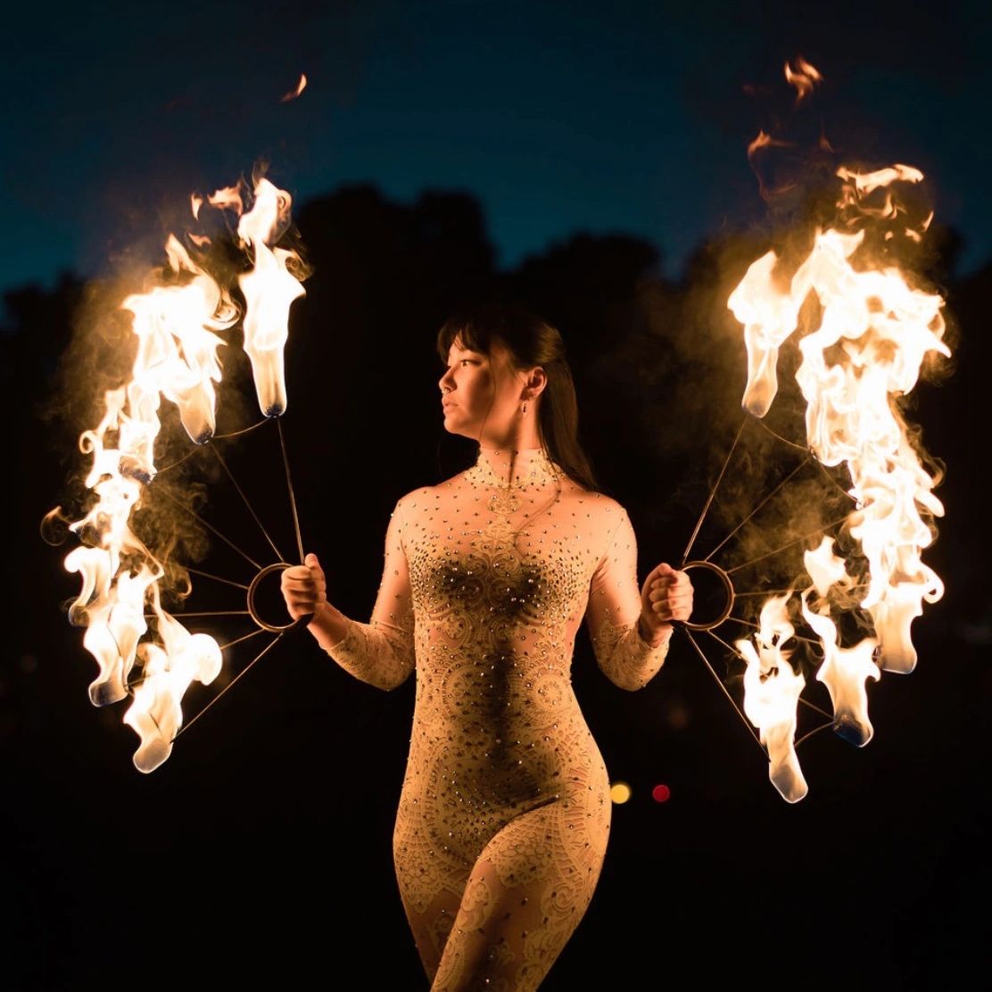 Professional fire performer entertaining guests at a luxury event in San Diego