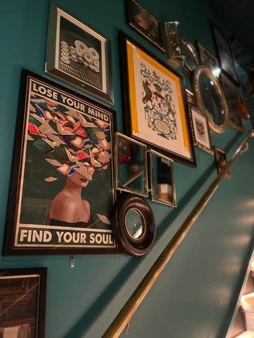 layered pictures in a gallery wall