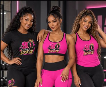 Three women in workout clothes posing together, smiling.