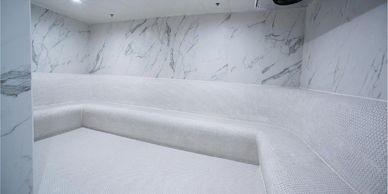Ice cold white room with marbled walls, an invigorating part of our luxury Korean spa & sauna