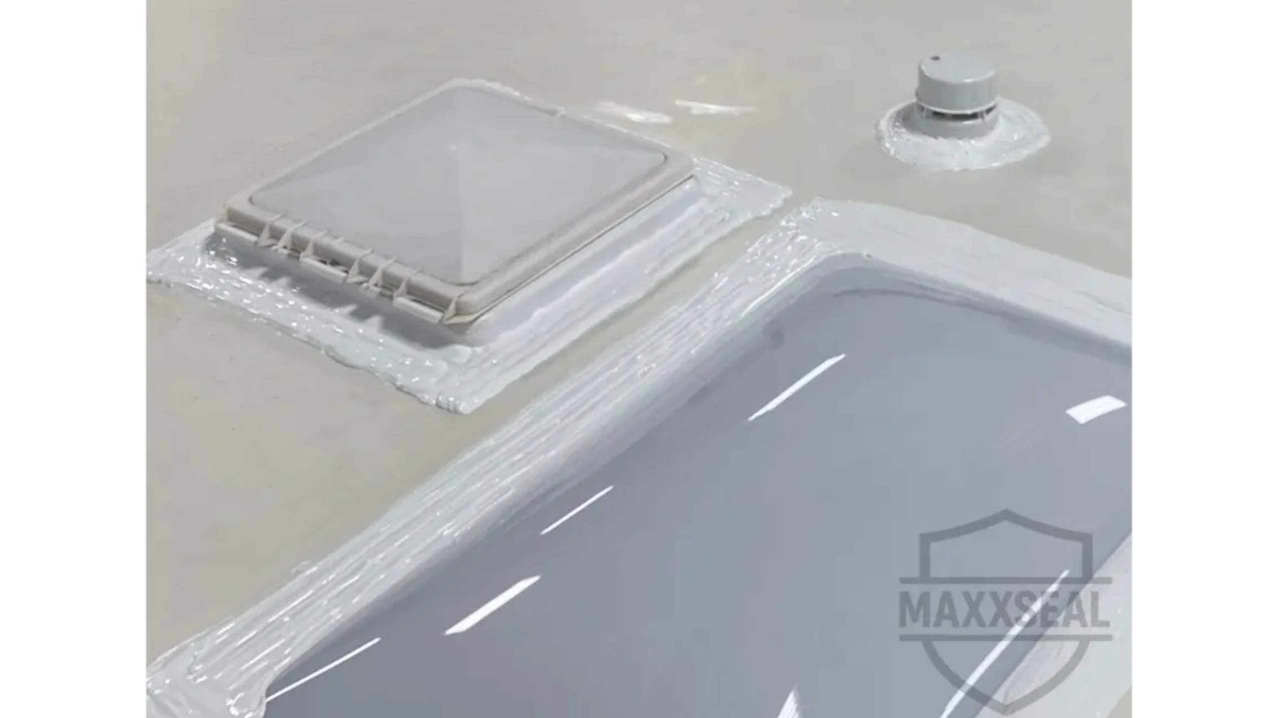 Stack of books next to pencils in a holder and a camera.