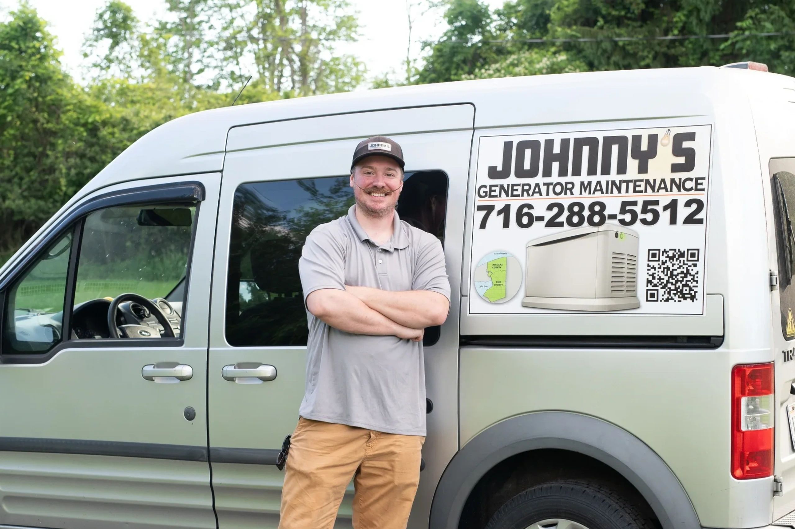 Owner standing in front of work van with Johnny's Generator Maintenance logo.