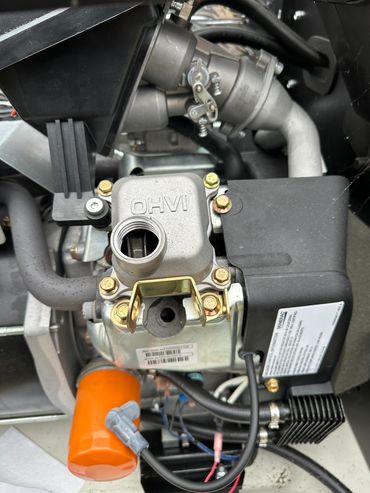 Close-up of an OHVI engine with visible components and wiring.