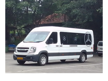 White Force Urbania with Mercedes logos on windows.