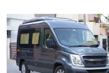 Gray URBANA van parked outside a building available for rent