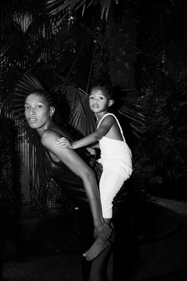 Black and white portrait of mom and daughter in jungle
