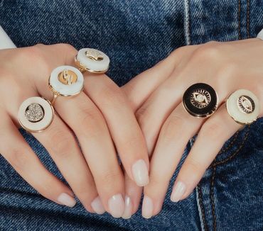 Fumul creates unique talisman combinations using marble in this rings in 14k gold and diamonds.