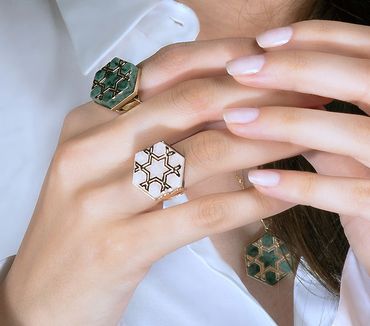 Fumul produces unique design jewelry and uses bold materials like marble in jewelry.