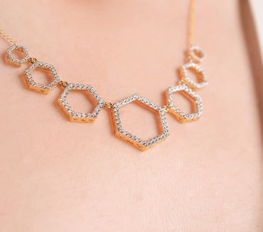 F.umul Jewelry Hexagonal diamond necklace set in 14k yellow gold.