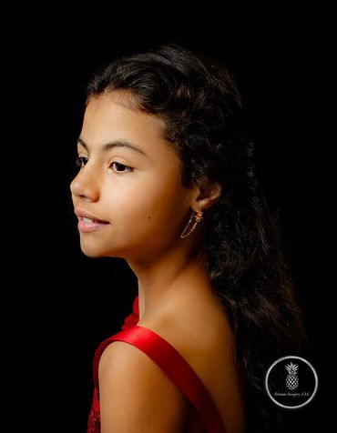 Fine Art Portrait Editorial Vibe Charleston SC. Hispanic girl profile on black backdrop red dress