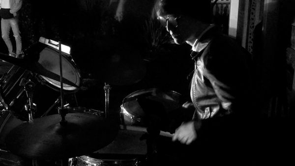 Me playing drums for the local Santa Cruz band Pink Rabbit at a house-show.