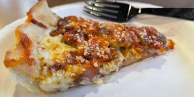 Chicago style meat lover slice of pizza from East of Chicago Pizza in Upper Sandusky Ohio.