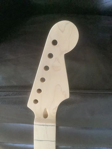 Close up on the final cut of the headstock.