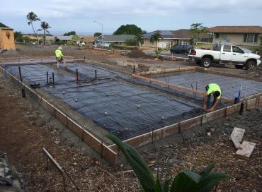 Residential concrete foundation slab preparation on the Big Island of Hawaii featuring reinforced st