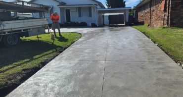 Residential concrete driveway installation on the Big Island of Hawaii featuring a durable textured