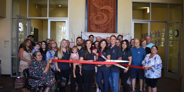 Roseville Chamber of Commerce Ribbon Cutting Ceremony, group of people smiling
