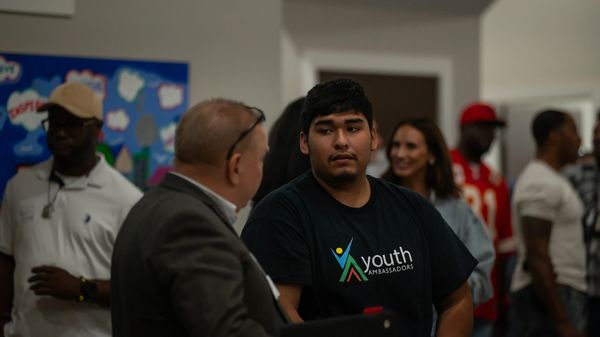 Ambassador talking with guest.