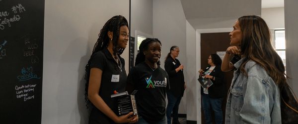 Ambassadors speaking with guest