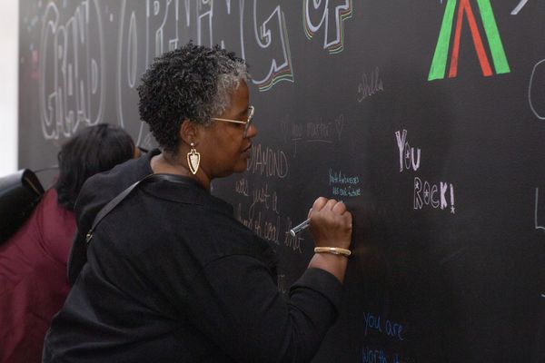 Guest signing our chalk board wall