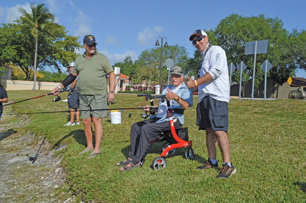 Anthony Yankowski, 103, of Pompano Beach, won second place in the fishing contest; at left is his so