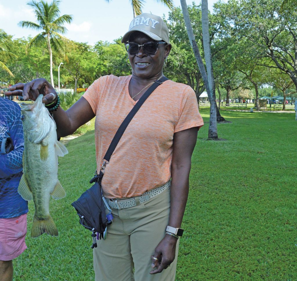 Woman holding large mouth bass