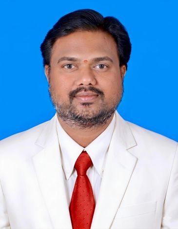Man in white suit with red tie.