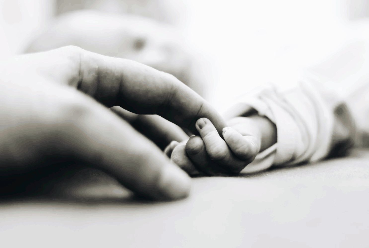 Holding baby's hand