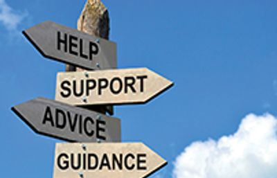 Signpost showing help-related directions under a blue sky.