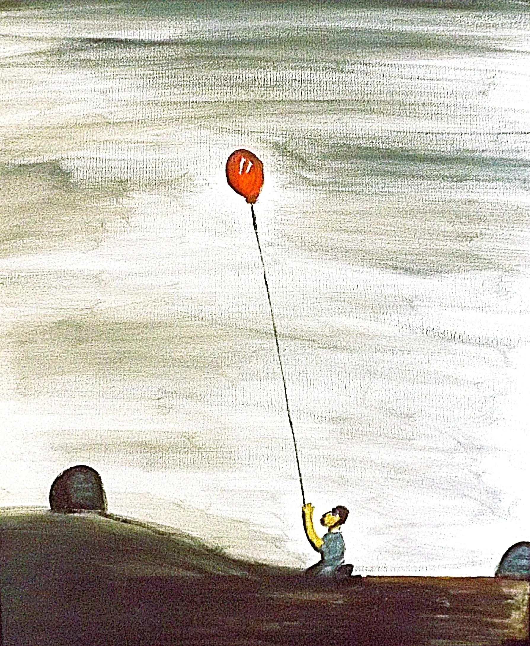 Black pencils in a gray holder next to a stack of white magazines with a camera in the background.