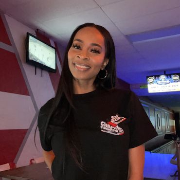 A woman smiling at a charity event