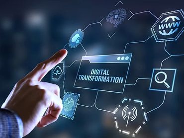 A hand interacts with a digital interface displaying 'Digital Transformation' and related tech icons.
