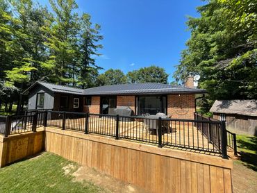 Custom built deck with black picket railing