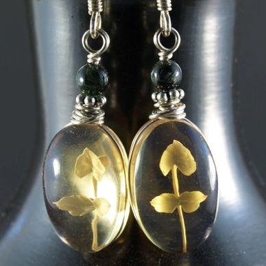 Handmade arrings made with carved Mexican amber, obsidian, and sterling silver, by AlmaMia Jewelry.