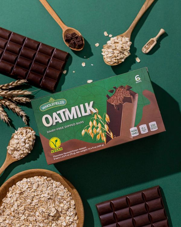 Dairy free, vegan, oatmilk chocolate frozen dessert covered with Belgian chocolate ice cream bar