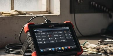 Diagnostic tablet device used in an automotive repair shop.